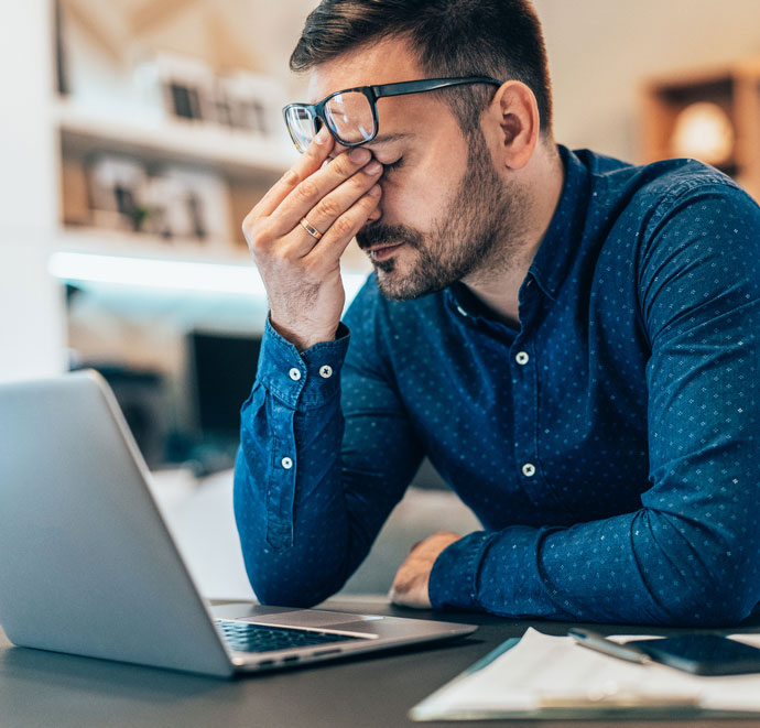 man suffering from a migraine