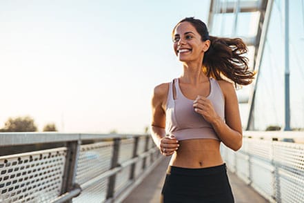 woman running after her breast reconstruction in NYC